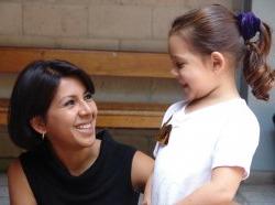 Child advocate smiling at young child